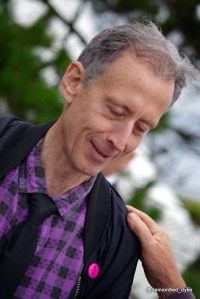 a hand on Peter Tatchell's shoulder